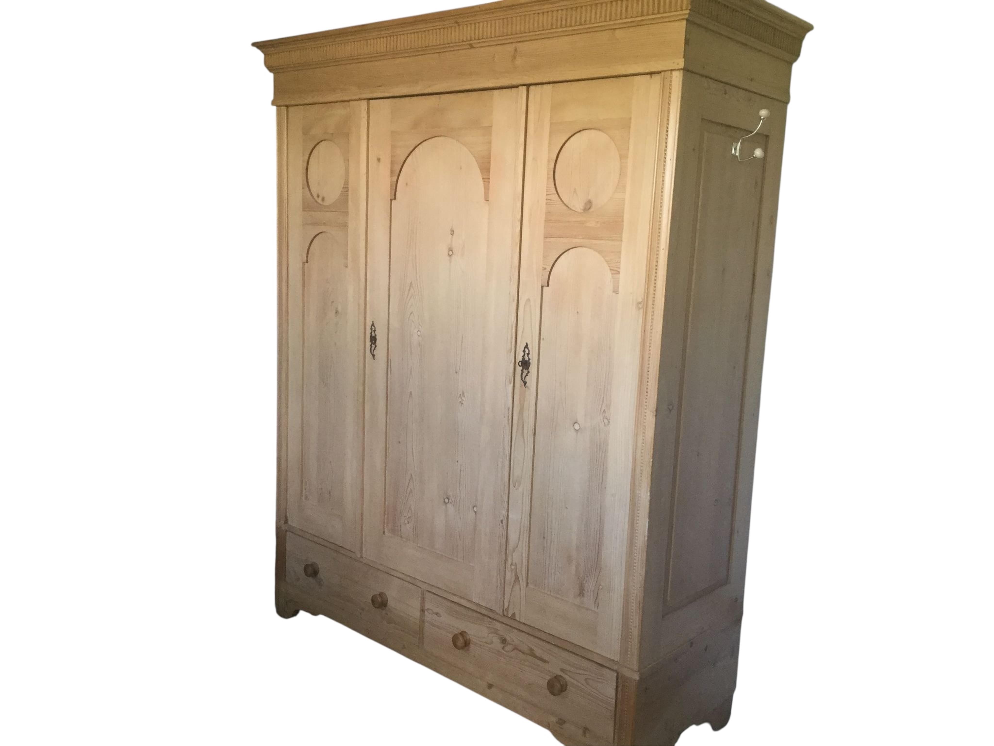 A 19th century Continental pine 'knockdown' triple wardrobe, width 170cm, depth 64cm, height 209cm